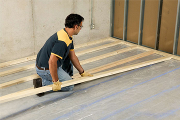 Installation, reinforcement, alignment, and finishing for strong and level flooring support.