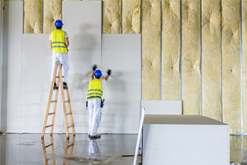 Frame construction, drywall installation, insulation, and finishing for sturdy and well-insulated walls.