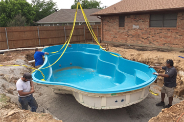 Efficient excavation, precise pool shell placement, plumbing setup, and system testing for a functional pool.